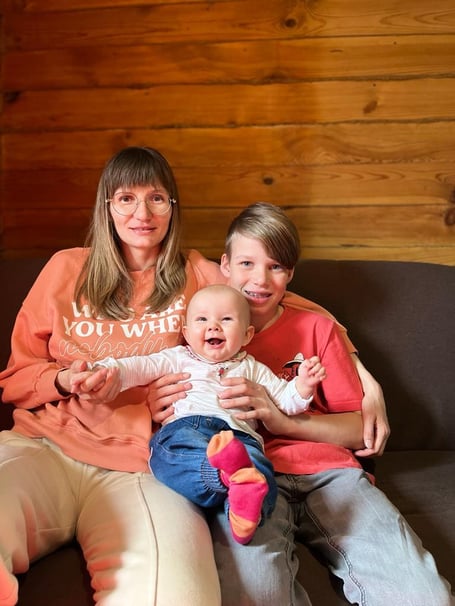 Mum Olha, six-month-old Maria and brother Illia, 11
