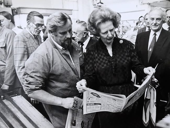‘Dolly’ talks then-prime minister Margaret Thatcher through the printing process as Sir Ray Tindle looks on, during Maggie’s visit to the Farnham press in 1985