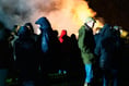 Crowds flock to firework displays despite the rain