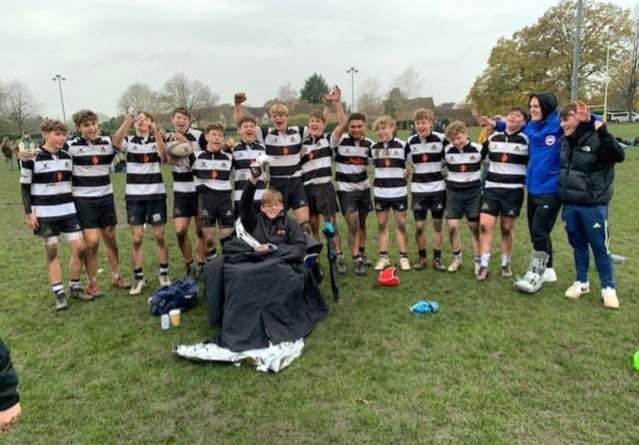 Winners are grinners – the under-16A squad pose with the silverware