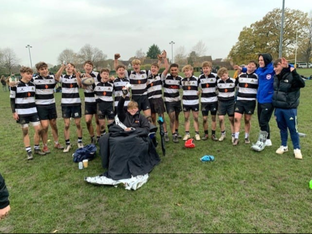 Winners are grinners – the under-16A squad pose with the silverware