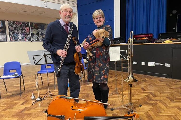 Golden retriever JJ with Clive and Sue from the Basingstoke Symphony Orchestra.