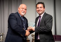 Mike Gatting presents Rowledge wicketkeeper with 'golden gloves' award