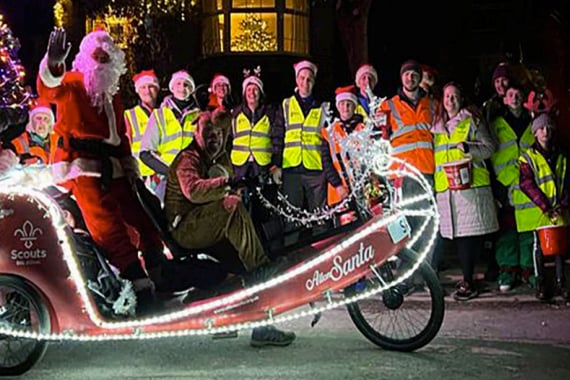 Santa on his eco sleigh with Alton Round Table and 8th Alton Scout Group members, December 2022.