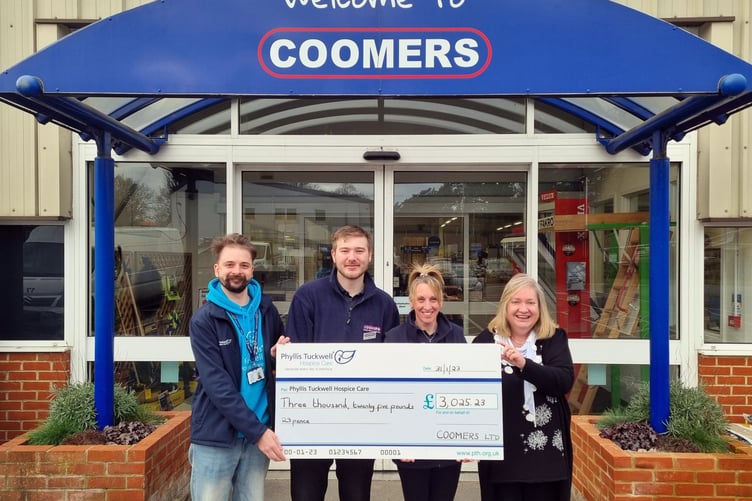 Phyllis Tuckwell’s Tom Enser (left) receives the fundraising cheque