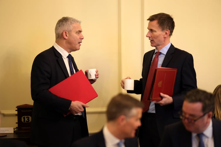 Health Secretary Steve Barclay and Chancellor of the Exchequer Jeremy Hunt talk before Prime Minister Rishi Sunak holds his weekly Cabinet meeting from 10 Downing Street