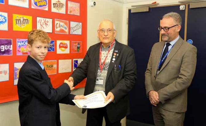 Oliver Scobie being presented with a certificate by Alton Rotary president Mike Sanders, February 2023.