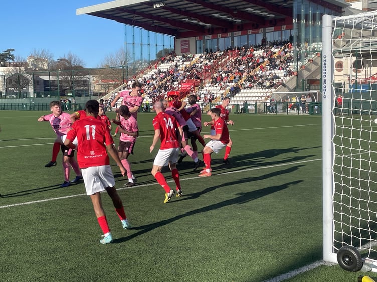 Farnham Town go close to scoring from a corner at Jersey Bulls