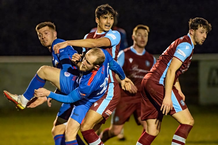 Action from Badshot Lea's 4-0 win against Raynes Park Vale