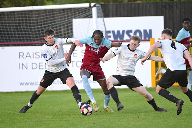 Shamal Edwards competes for possession during Farnham’s cup final win