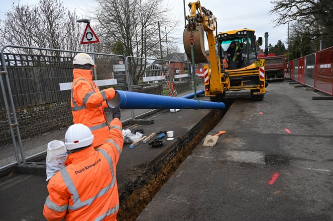 South East Water workers installing the new water pipe in West Street, Farnham