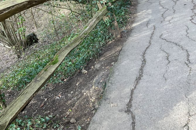 A section of the diagonal path across Farnham Park is slowly disappearing into a sinkhole