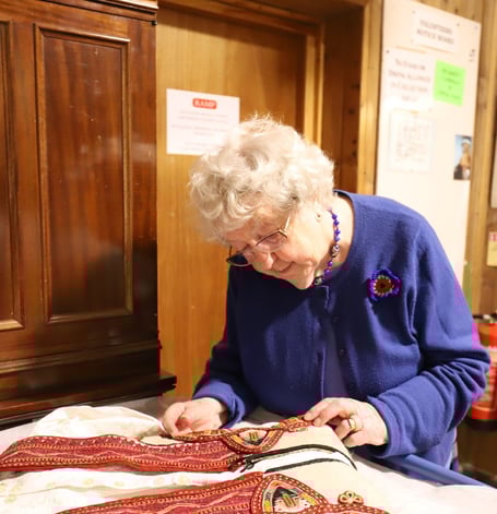 91-year-old Freda working on Haslemere Museum's textiles collection