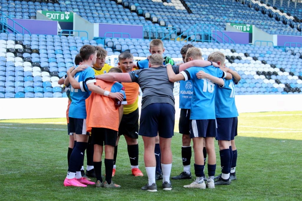 JK Academy under-13s won the 'Play on the Pitch' tournament at Elland Road