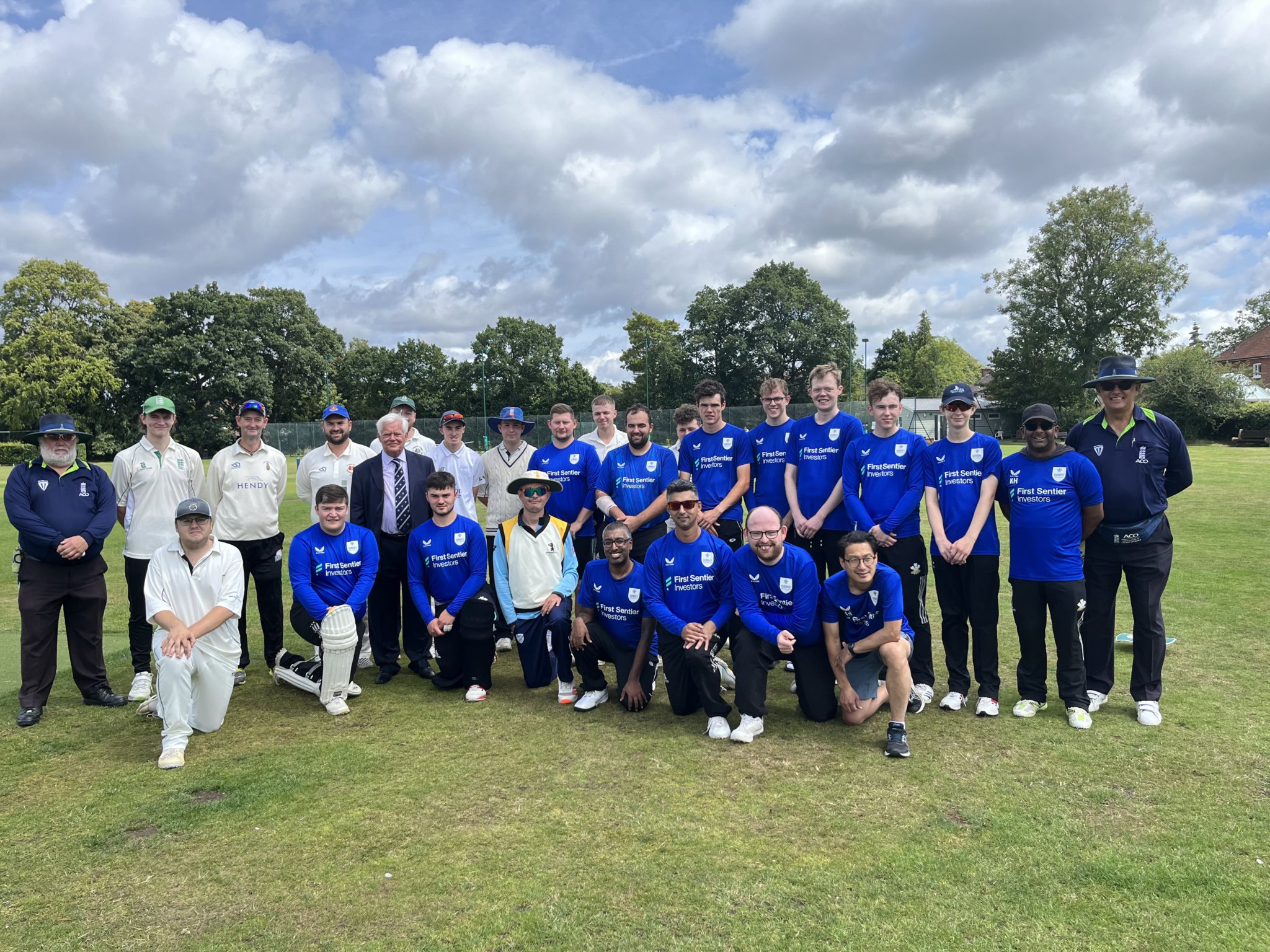 Rowledge Cricket Club president David Metcalfe with the Surrey and Hampshire teams