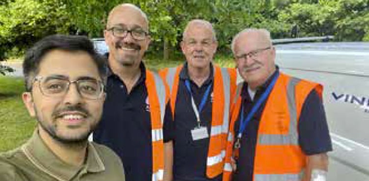 Cllr Adeel Shah and pothole fixers, St Lucia Park, Bordon, July 2023.