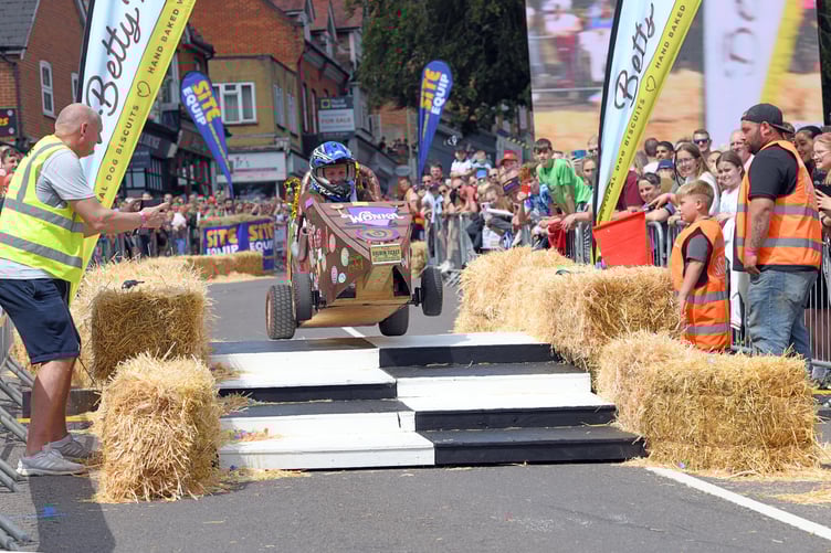 BORDON SOAPBOX
BORDON, HAMPSHIRE
ENGLAND
23rd JULY 2023
On Sunday 23rd July 2023 Whitehill & Bordon in Hampshire was transformed into the ultimate community driven soapbox spectacle, the official Bordon Soapbox Derby
With the main road through the town closed to  traffic the hundreds of spectators were able to walk around the attractions that had been put in place in the early hours of Sunday before gathering many deep on Chalet Hill to watch the 'soapbox racers' take on the challenge to be the fastest competitor to get to the Finish Line ! 
Some of the racers were quick, some were slow, and some driver's after having spectacular spills were permitted to run to the Finish Line as long as they were carrying 'any part of their soapbox' ! 
(Photo by Malcolm Wells)
 
Standard reproduction rates apply, contact Malcolm Wells to arrange payment - Mobile: 07802-217-569 
malcolmrichardwells@gmail.com