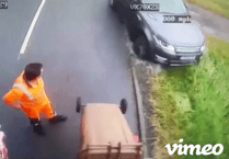 Oops! Range Rover 4x4 drives into a ditch undertaking a bin lorry