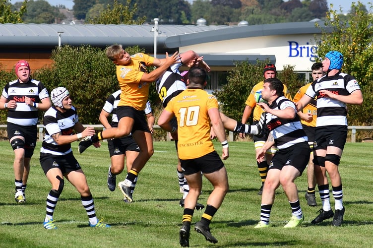 No holds barred as both teams go for the ball at the kick off
