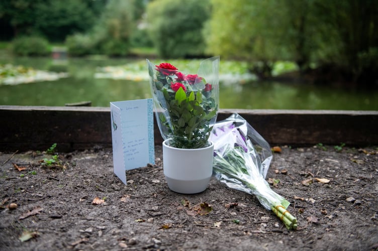 Flowers at Kingsley Pond after a woman has been arrested on suspicion of murder after a two-year-old girl died last night having been found in the village pond the day before. Kingsley, Hampshire, 12th September 2023  See SWNS story SWBNpond