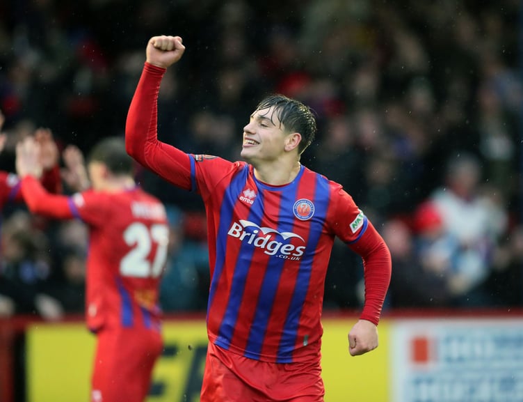 Josh Stokes celebrates his second goal against Stockport County
