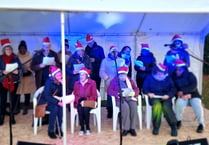 Festive joy for Bordon group on choir's debut at Grayshott light event