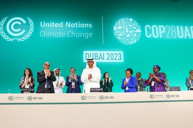 NOVEMBER 30: His Excellency Dr. Sultan Al Jaber, COP28 President (L5), and participants applaud at the UNFCCC Formal Opening of COP28 during the UN Climate Change Conference COP28 at Expo City Dubai on November 30, 2023, in Dubai, United Arab Emirates. (Photo by COP28 / Christopher Pike)