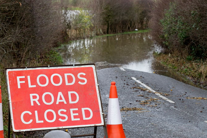 Surrey and Hampshire county council's responded to hundreds of reports of flooded roads on Thursday night and Friday morning