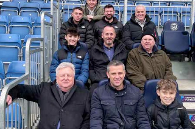 Gary Magee (bottom row, centre, next to his dad and son) with his fellow matchday sponsors, Portsmouth v Leyton Orient, January 13th 2024.