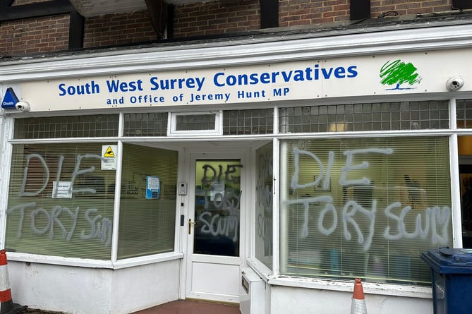 The front window of Jeremy Hunt's constituency office in Hindhead has been vandalised