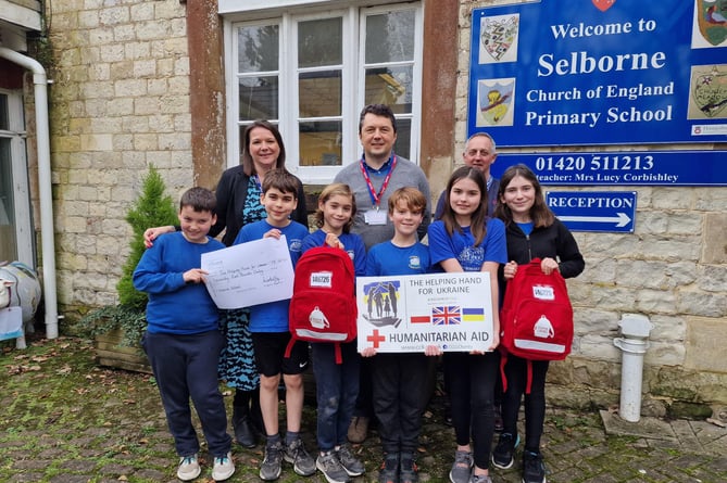 Students from Selborne C of E Primary School with their teacher and Simon and Nick Butler.