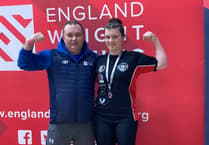 Rising weight-lifting star wins silver thanks to community support