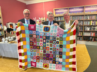 Library donates community handcrafted blankets to charity auction
