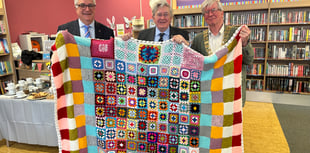 Library donates community handcrafted blankets to charity auction