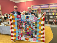 Library donates community handcrafted blankets to charity auction