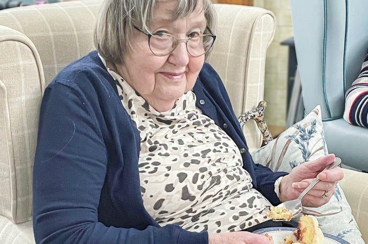 Susan Osborne enjoying her birthday cake.