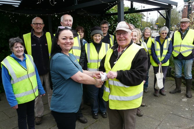 Number One The Square owner Nikki Bonner hands over the money raised from donations for the Liphook in Bloom team