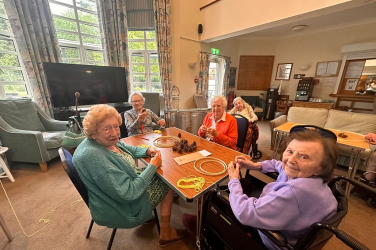 Residents create bee-decorated mobiles