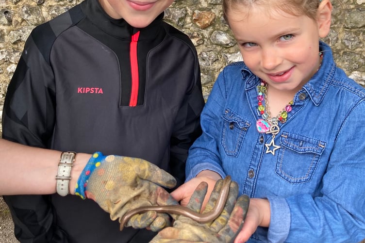 Bonnie and Barney Greaves with slowworm