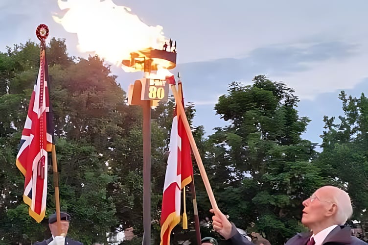 Roy Bicknall lights the beacon