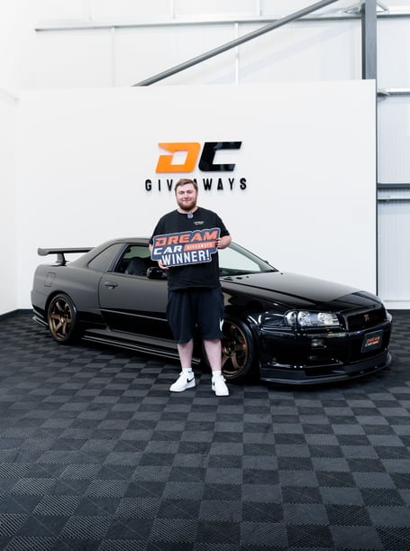 Local Jackpot winner, Harrison Cooper, with his new car 