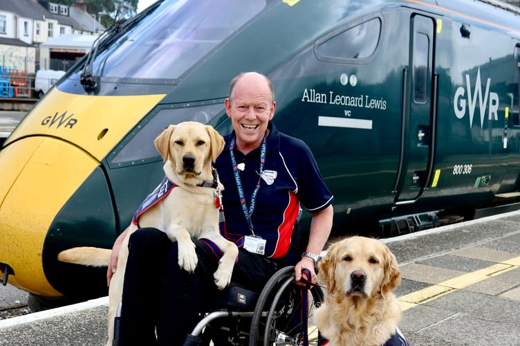 Allen with his companion ET, left, and another service dog