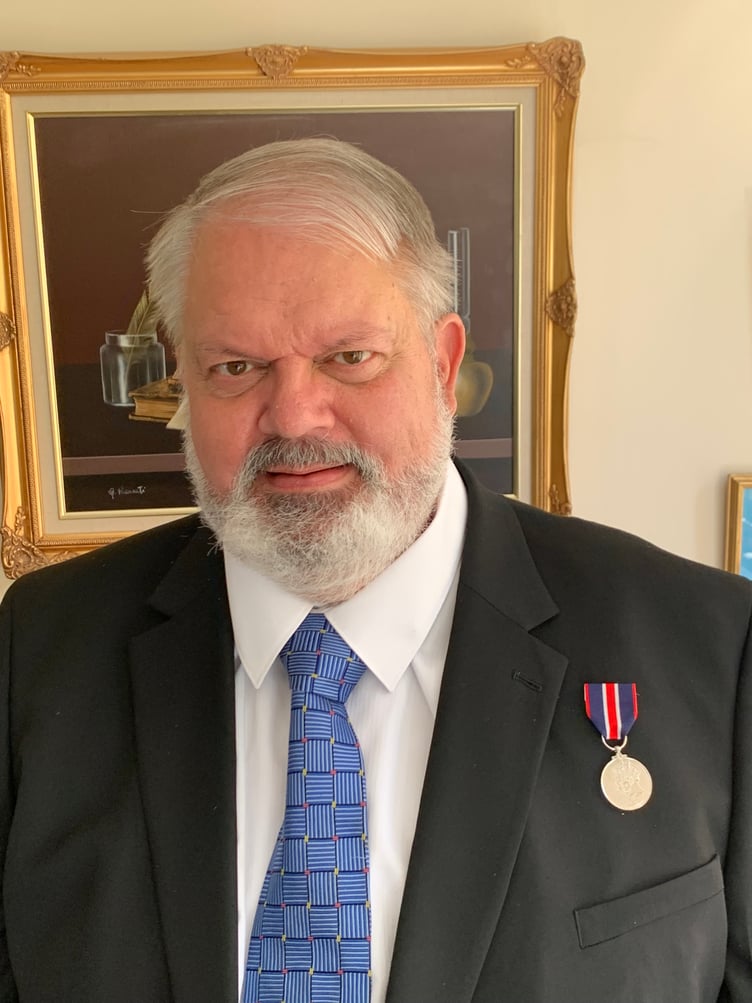 Haslemere lawyer, Bryan Boese, with his Coronation Medal