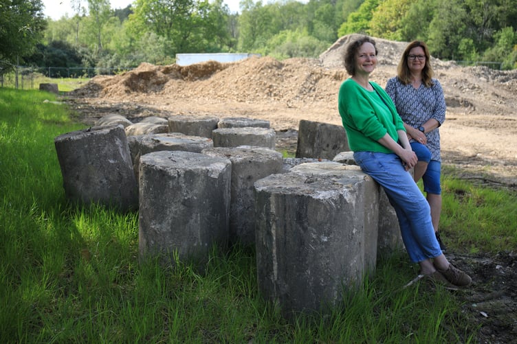Tania Pons, local historian, and Dawn Cansfield, archaeologist and local history researcher, with the tank traps unearthed at Perceval Grange