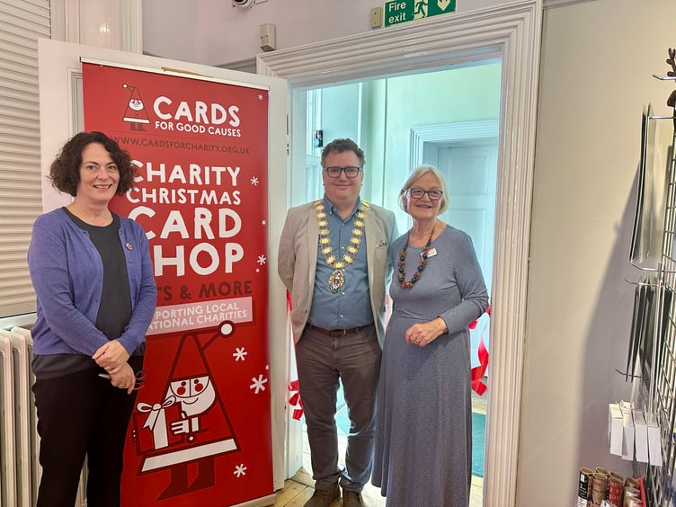 Town Clerk Lisa O'Sullivan, Mayor Oliver Leach, and manager of Haslemere's Cards for Good Causes, Maggie Monteath