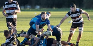 Farnham beat Guildford to remain seven points clear at the top