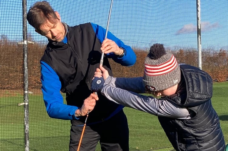 Petersfield Golf Club professional Donovan Hall with a pupil at Petersfield Golf Club