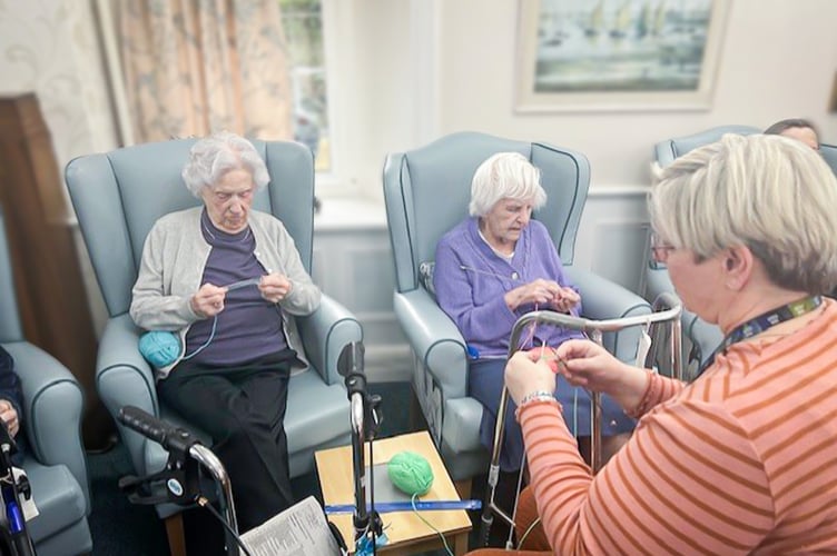 Redcot residents, Joyce Douglas and Joan Ferry with Activities Coordinator, Jenny Ryder enjoying a Knit and Natter session