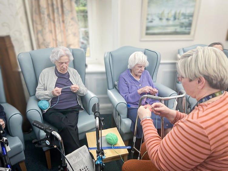 Redcot residents, Joyce Douglas and Joan Ferry with Activities Coordinator, Jenny Ryder enjoying a Knit and Natter session