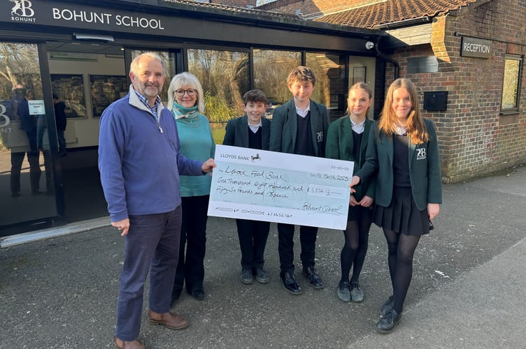 Bohunt students hand over cheque to Liphook Food Bank
